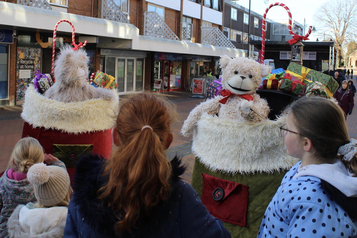 stocking up! puppets bear and rabbit perform in christmas walkabout act for lights switch on event