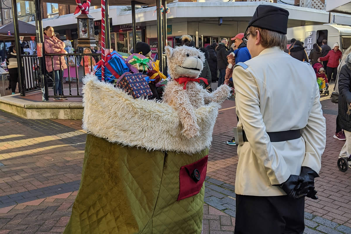 stocking up! bear puppet talks to kids in the streets in christmas performance